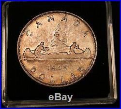 1945 Canada Silver Dollar. Rare date. Nicely toned Coin