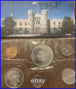 Canadian mint 1963 and 1964 coins with the 1964 $1 commemorating Charlottetown